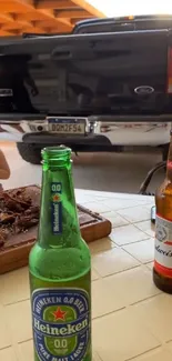 Beer bottles with a truck backdrop on a sunny day.