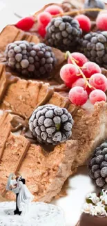 Delicious waffle dessert with berries and cake art on a white plate.