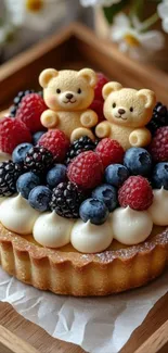 Berry tart decorated with cute bear figures and fresh berries.