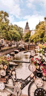 Clock-covered bicycle with flowers on an Amsterdam canal bridge.