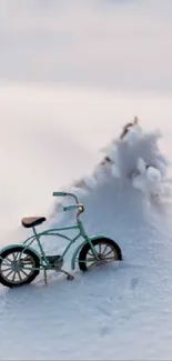 Miniature bicycle in snowy landscape with serene winter backdrop.