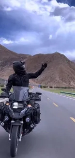 Motorcyclist on a scenic mountain road, capturing adventurous freedom.