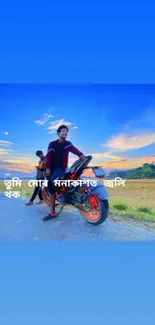 Motorcyclist on a road with a stunning sunset and blue sky backdrop in rural setting.