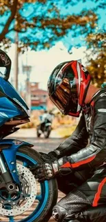 Biker kneeling beside a blue motorcycle.