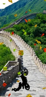 Biker performing a stunt on the Great Wall under clear sky.