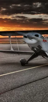 Vintage biplane on a sunset runway, capturing aviation heritage.