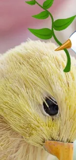 Artistic plush bird with a cartoon leaf on yellow background.