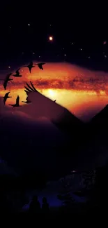 Bird silhouettes fly across a sunset sky with a galaxy in the background.