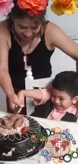 Child and adult cutting chocolate birthday cake with decorations.