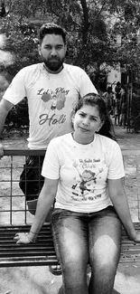 Black and white portrait of two people outdoors.