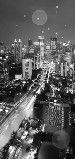 Black and white cityscape with lights reflecting urban ambiance.