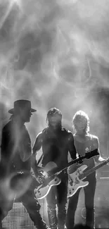 Silhouette of a rock band performing on stage in black and white.