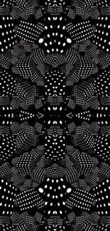 Black and white dotted pattern wallpaper design.