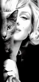 Black and white portrait with cat and woman.