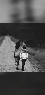 Two friends walk on a forest path in monochrome.