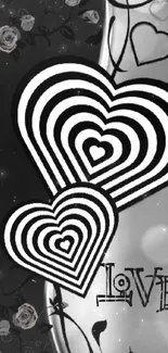 Black and white wallpaper with hearts and love text.