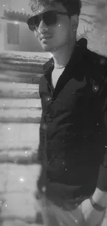 Stylish black and white portrait of a man on stone steps.