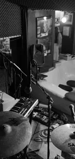 Black and white music studio with instruments.