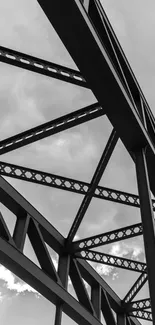 Monochrome wallpaper of an architectural steel bridge against cloudy skies.