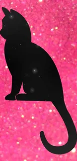 Silhouette of a black cat on a sparkly pink glitter background.