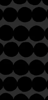 Mobile wallpaper with a black dot pattern on dark background.