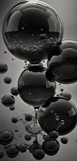 Black glass bubbles with reflective surface on mobile wallpaper.