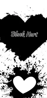 Artistic black heart with splash design on a wallpaper.