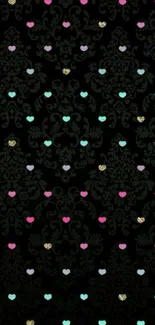 Black wallpaper with colorful heart motifs.