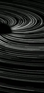 Abstract black and white swirl resembling a cosmic black hole.