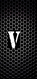 Bold 'V' on black honeycomb pattern wallpaper.