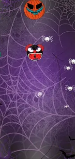 Halloween themed wallpaper with spider webs and cartoon pumpkins.