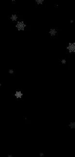 Elegant black wallpaper with snowflakes on a dark background.