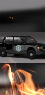 Black SUV with fiery elements on dark background.