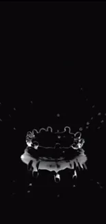 Black water splash on dark background mobile wallpaper.