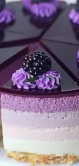 Blackberry cake with purple frosting, decorated with fresh berries.