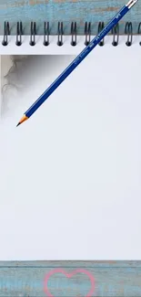 Minimalist blank notepad on rustic blue table with pencil.