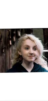 Blonde girl in rustic wooden background, serene expression.