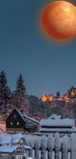 Blood moon over a winter village at night with snow-covered trees.