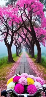 Bicycle path under pink blossom trees with colorful flowers.