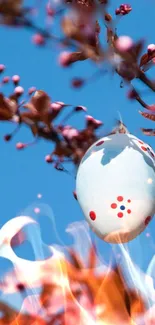 Artistic wallpaper with decorated egg and blooming branches.