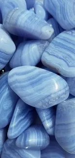 Close-up of blue agate stones with striped patterns.