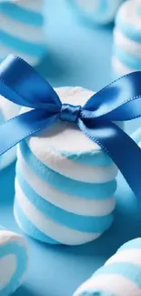 Blue and white striped candies stacked with a blue ribbon.