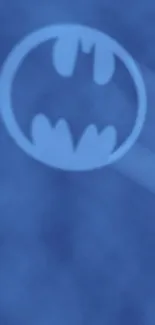 Blue Batman signal with misty background on mobile wallpaper.