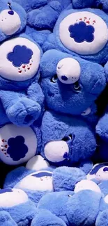 Mobile wallpaper of plush, blue bears stacked together.