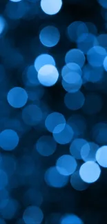 Blue bokeh lights creating a soft and serene phone wallpaper background.