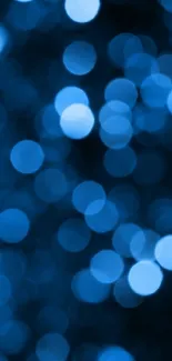 Blue bokeh wallpaper with soft glowing circles.