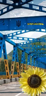 Blue bridge with sunflower under bright sky.