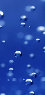 Floating bubbles against a deep blue background for mobile wallpaper.