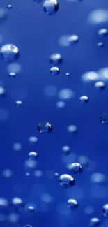 Serene blue wallpaper with floating bubbles.