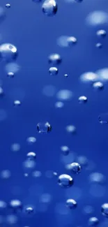 Serene blue bubbles on a dark blue background for calming mobile wallpaper.